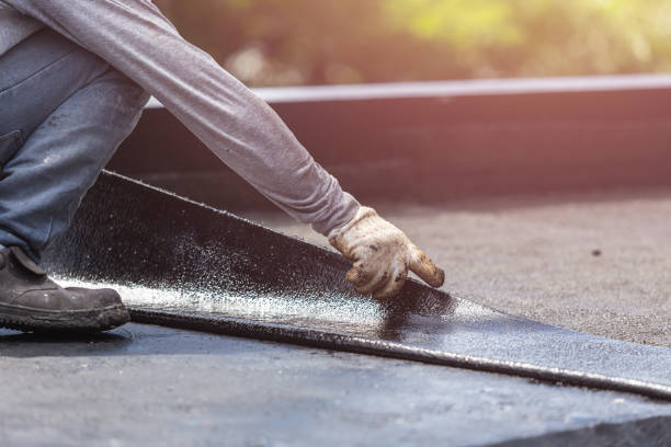 Professional Basement Waterproofing technician working in Hatley, WI
